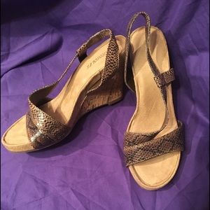 Comfortable in styleSnakeskin look w/ cork sandals
